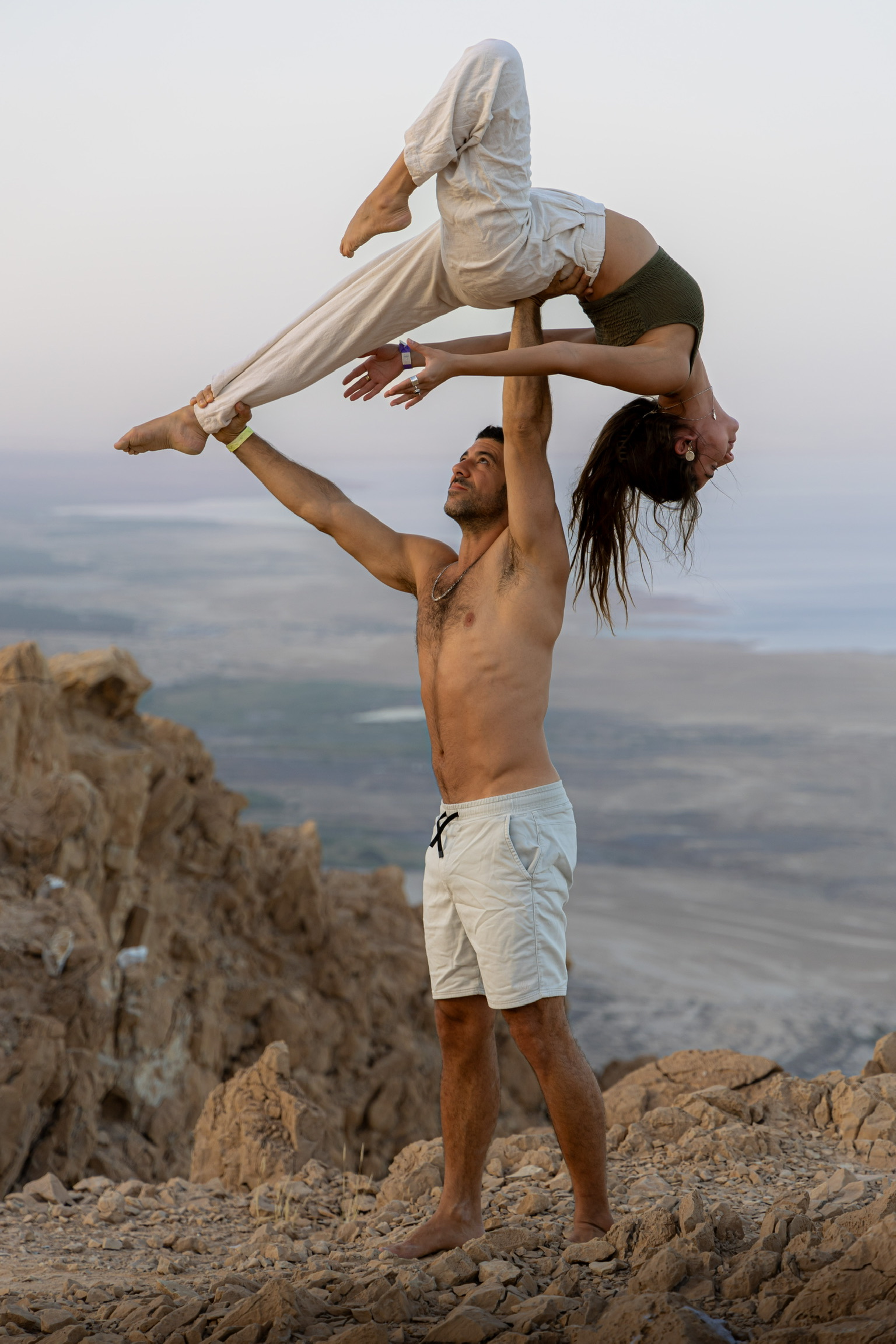 AcroYoga partners in flight pose